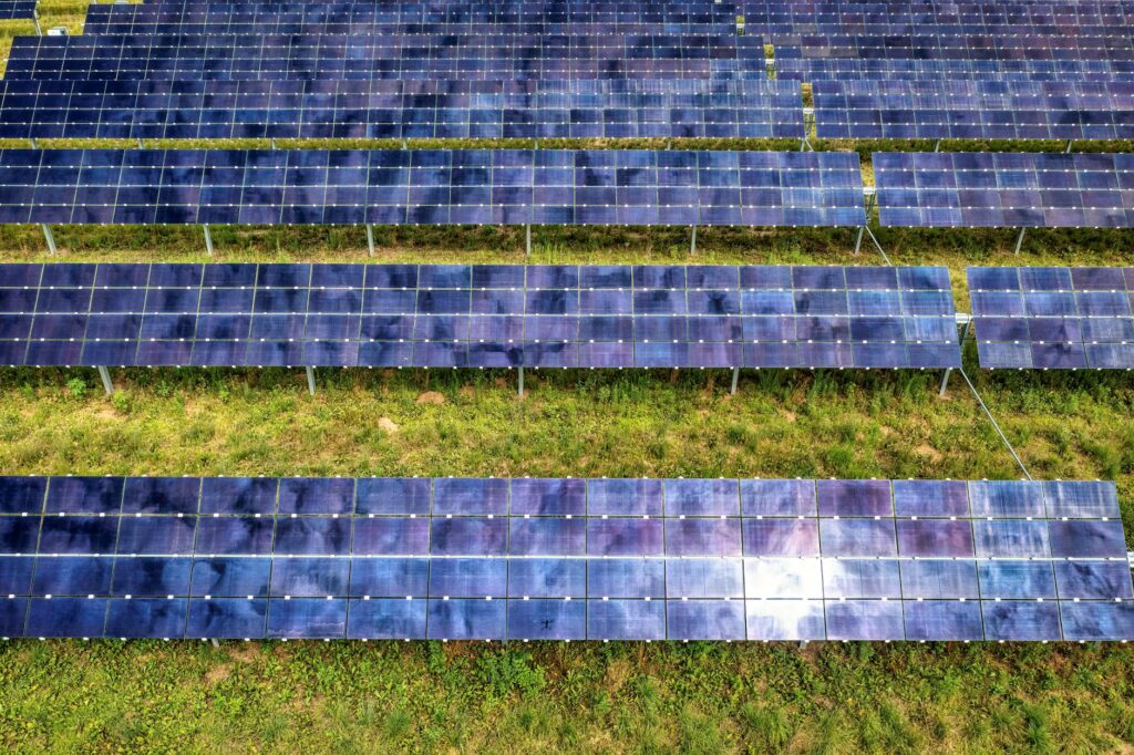 Drone shot of solar panel rows at a solar farm in Kellogg, MN, showcasing sustainable energy technol